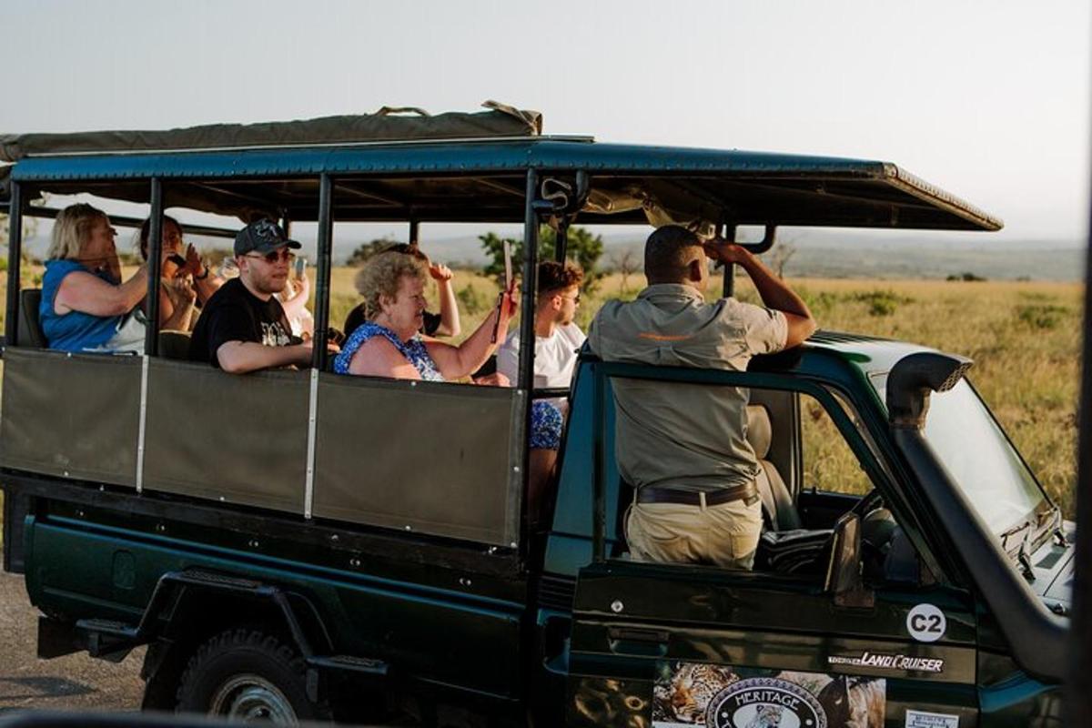 a group of people riding in the back of a jeep