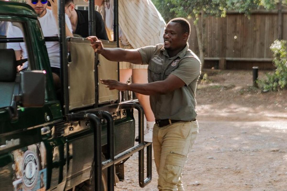 a man is standing next to a green truck