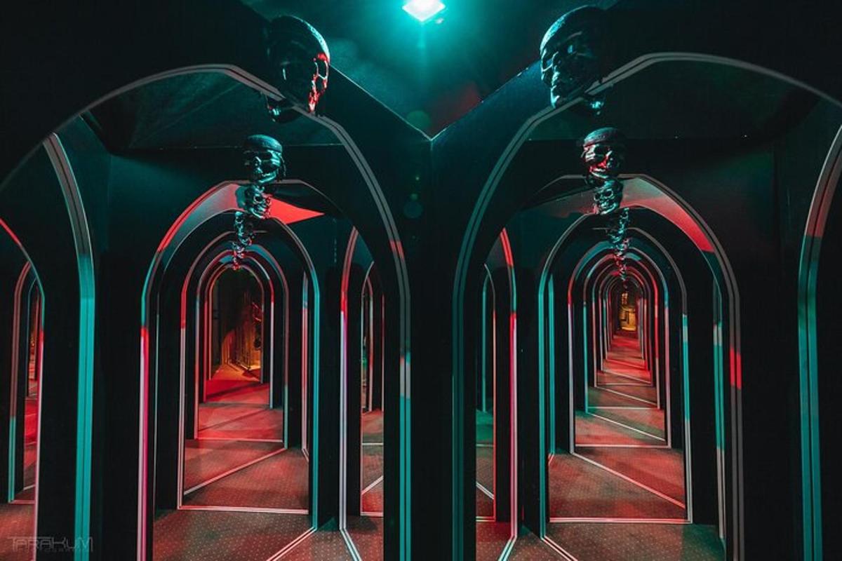 a row of archways in a dark room with lights