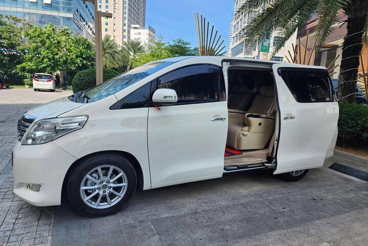 a white van with its door open on a street