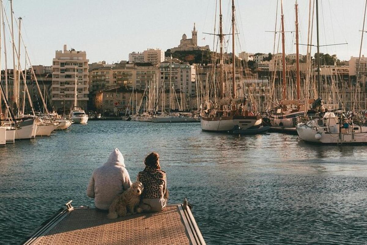 a girl and a stuffed animal sitting on a boat in a harbor