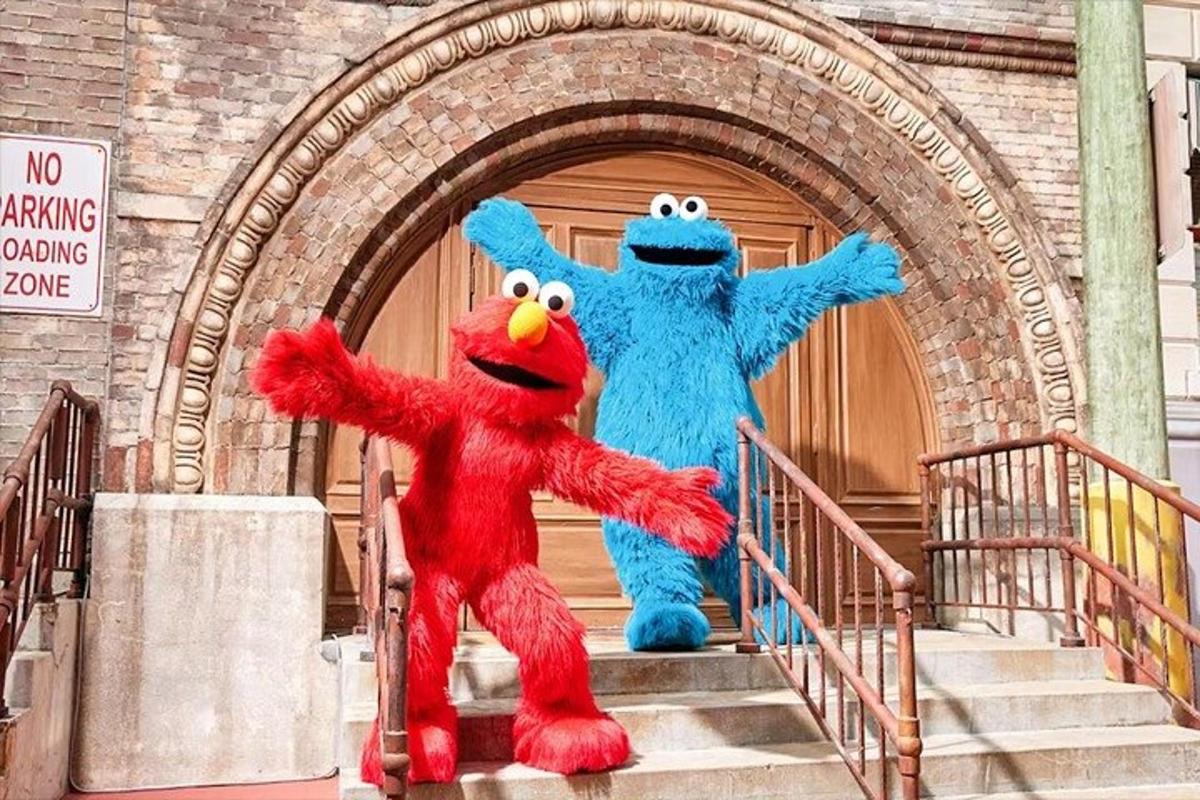 two mascots standing on the steps of a building