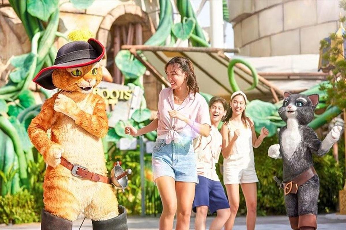 a woman is standing next to a teddy bear and children
