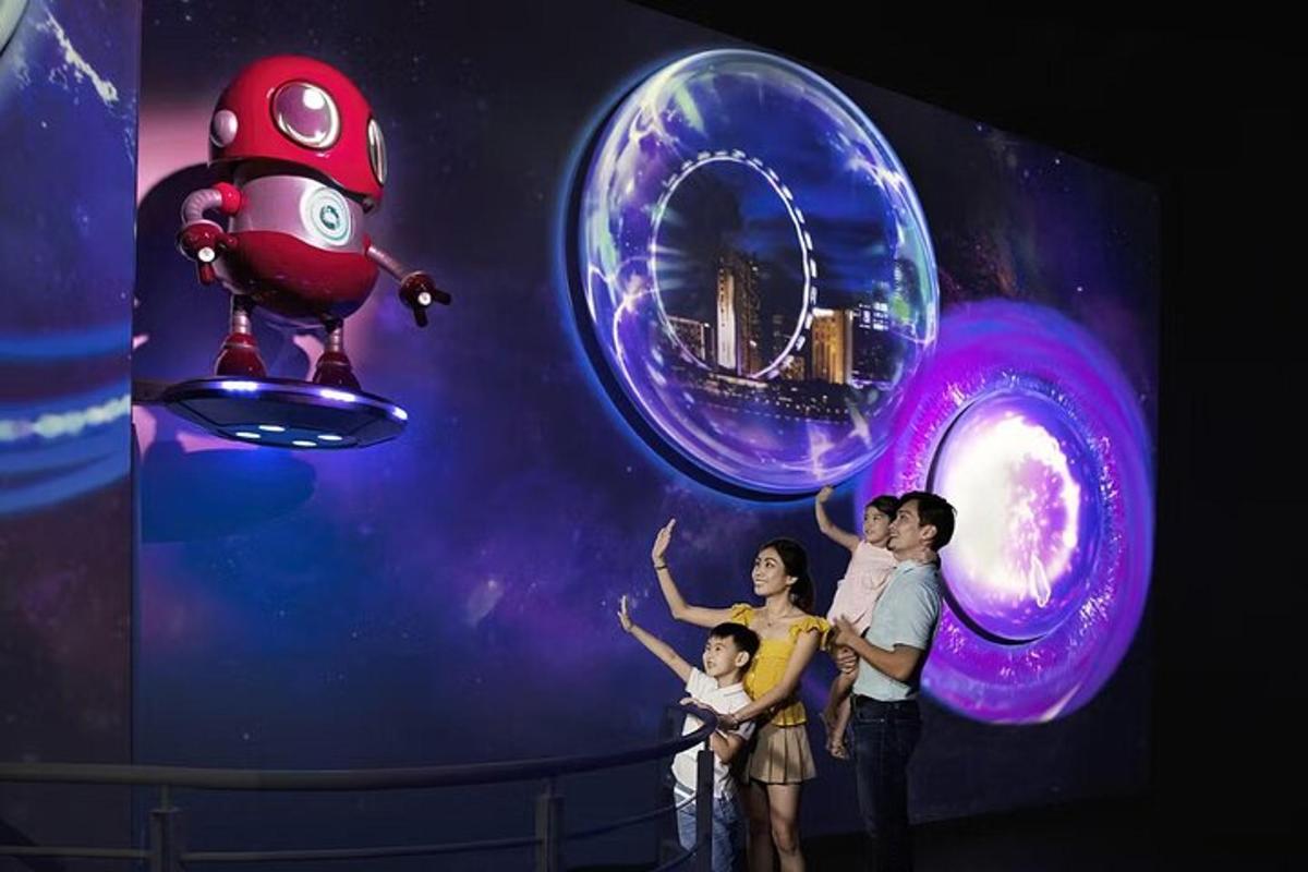 a family standing in front of a wall with planets