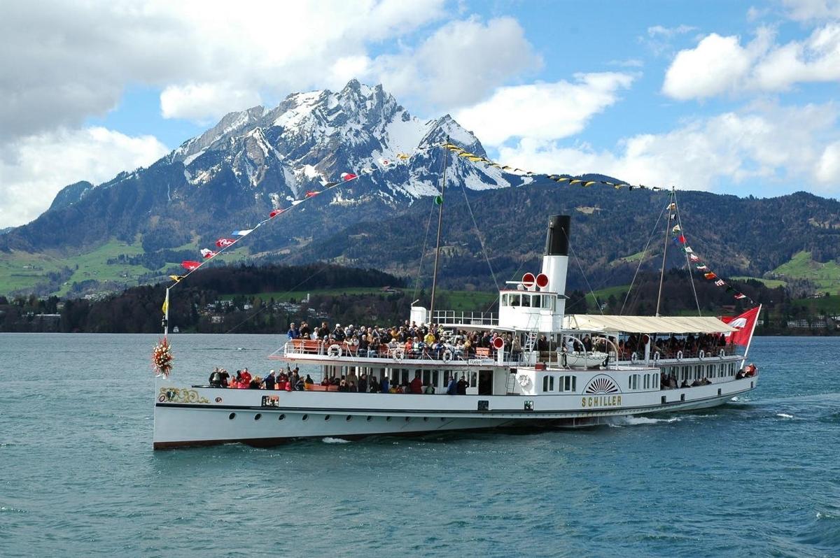 a group of people on a boat in the water
