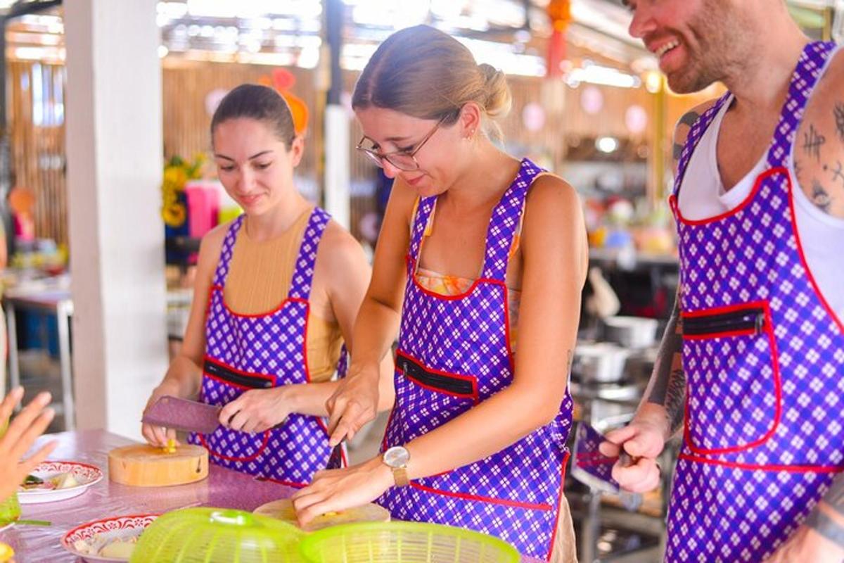 a group of people in a kitchen preparing food