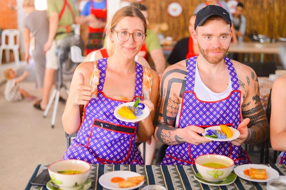 a man and a woman holding a plate of food