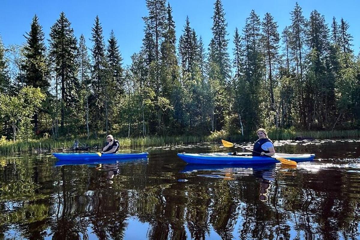 two people in kayaks on a river in the water