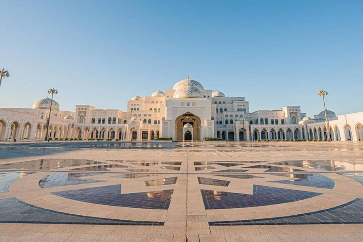 a large building with a fountain in front of it