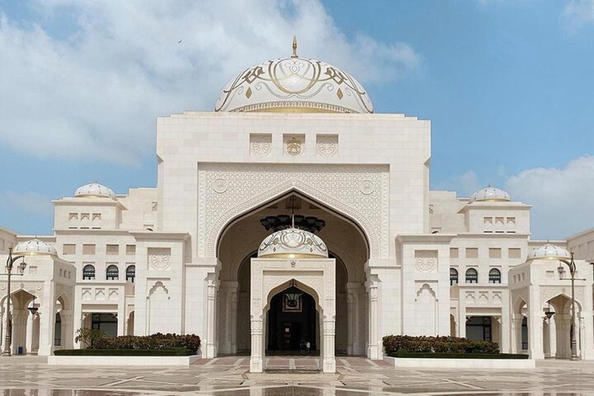 a large white building with a dome on top