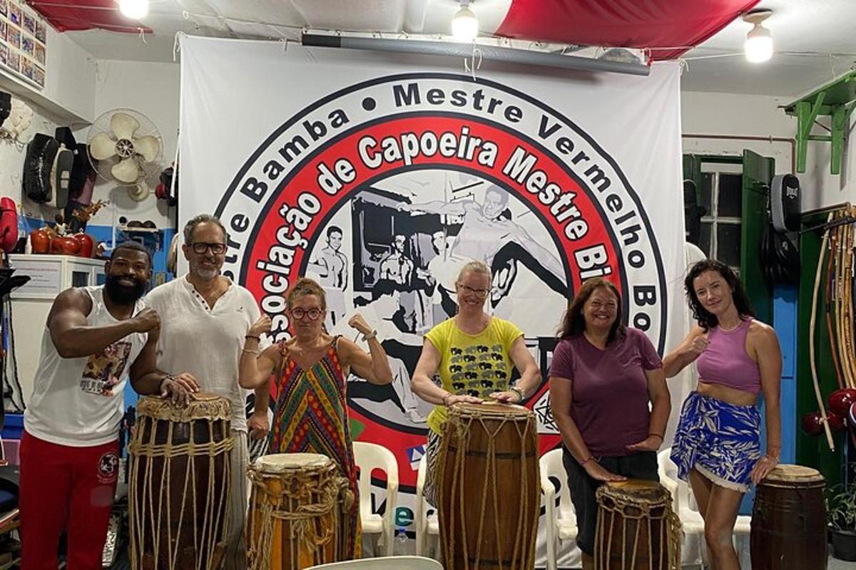 a group of people standing in front of drums
