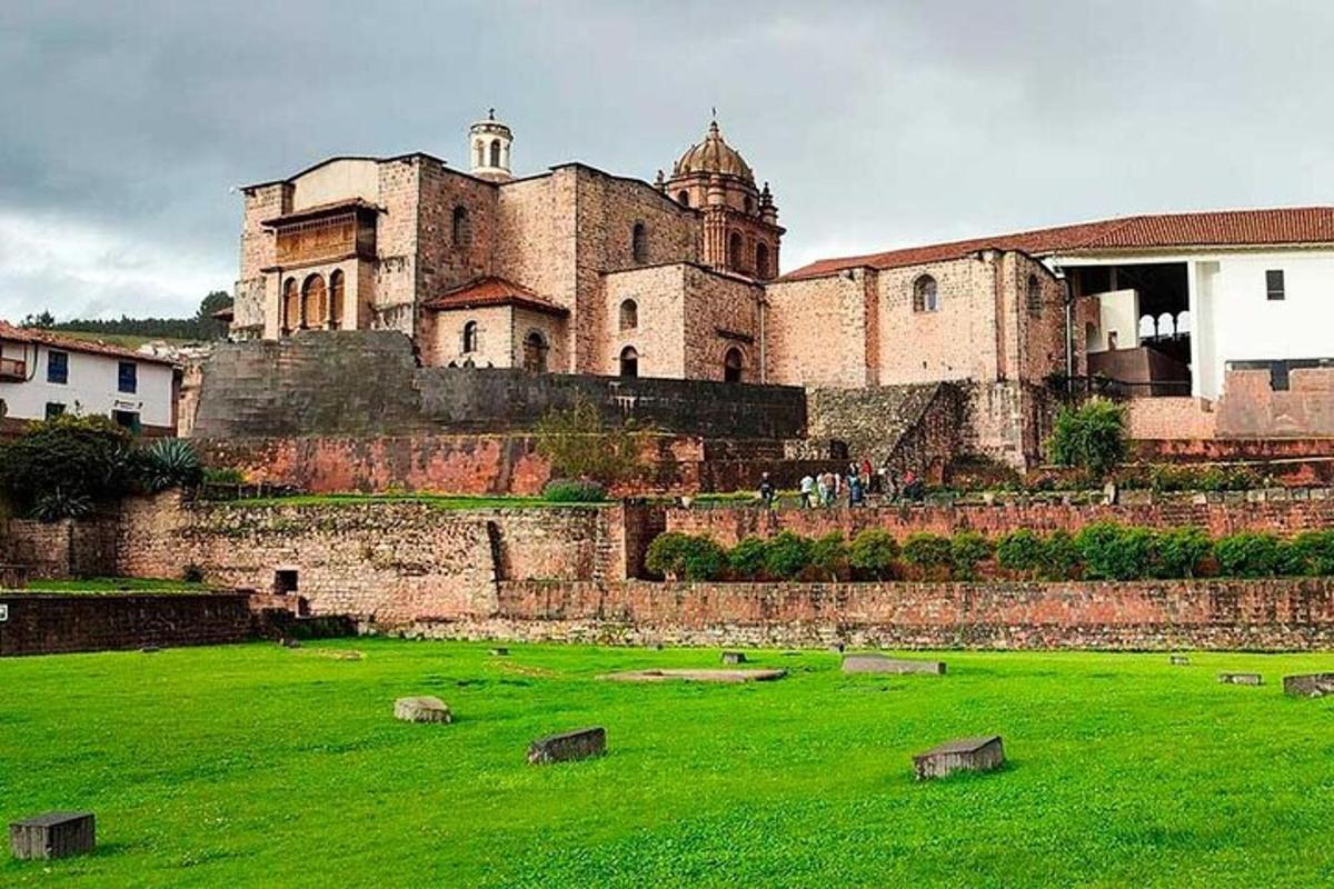 a large castle on top of a green field