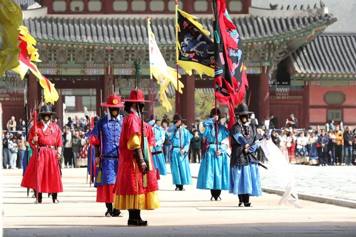 a group of people in uniforms walking in a parade