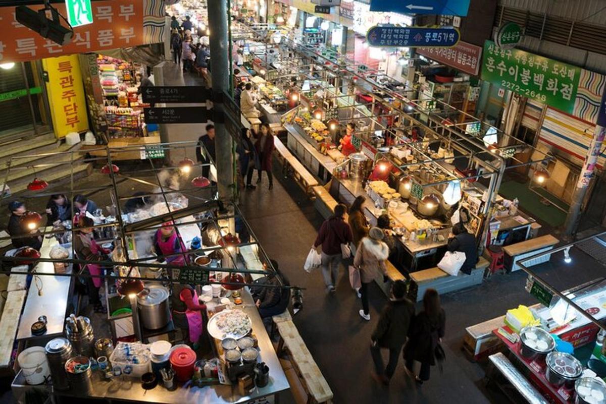 an overhead view of a market with people walking around