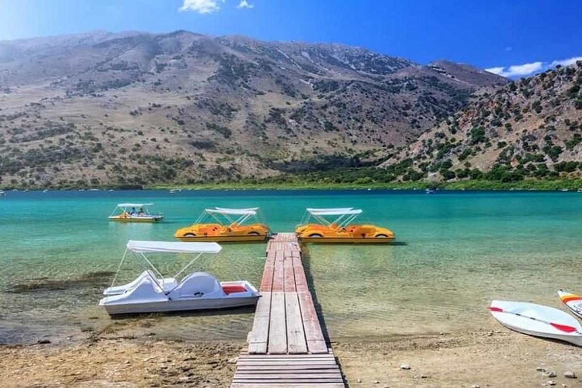 a group of boats on a dock in the water