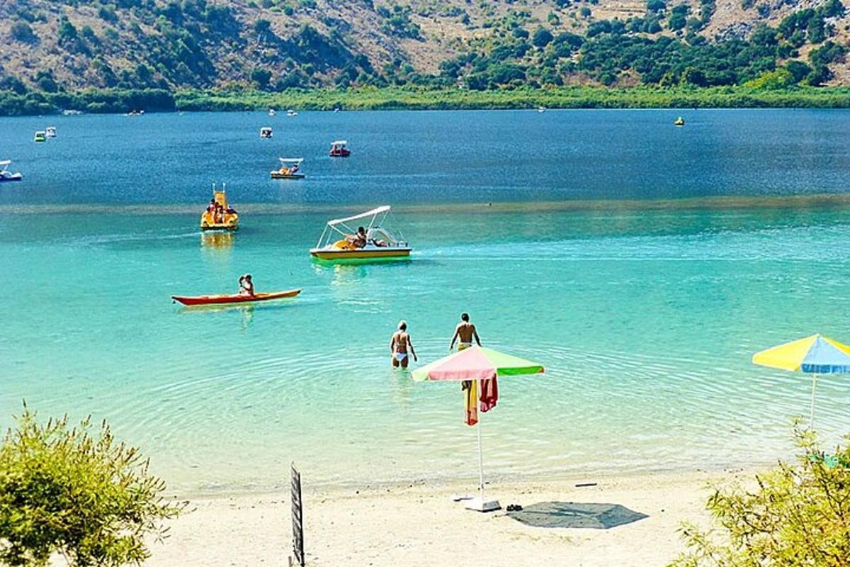 a group of people in the water at a beach