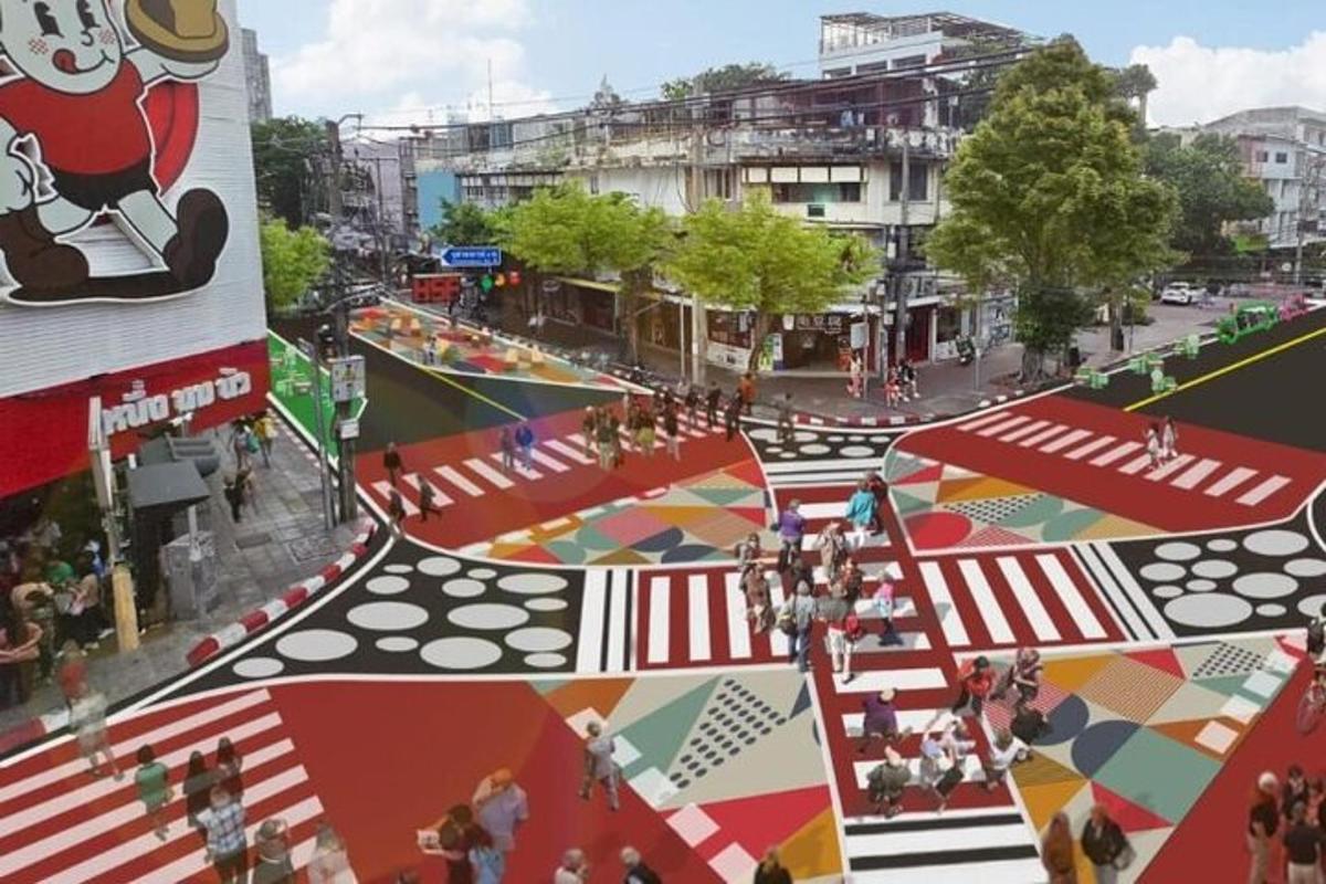an overhead view of a street with tents and people