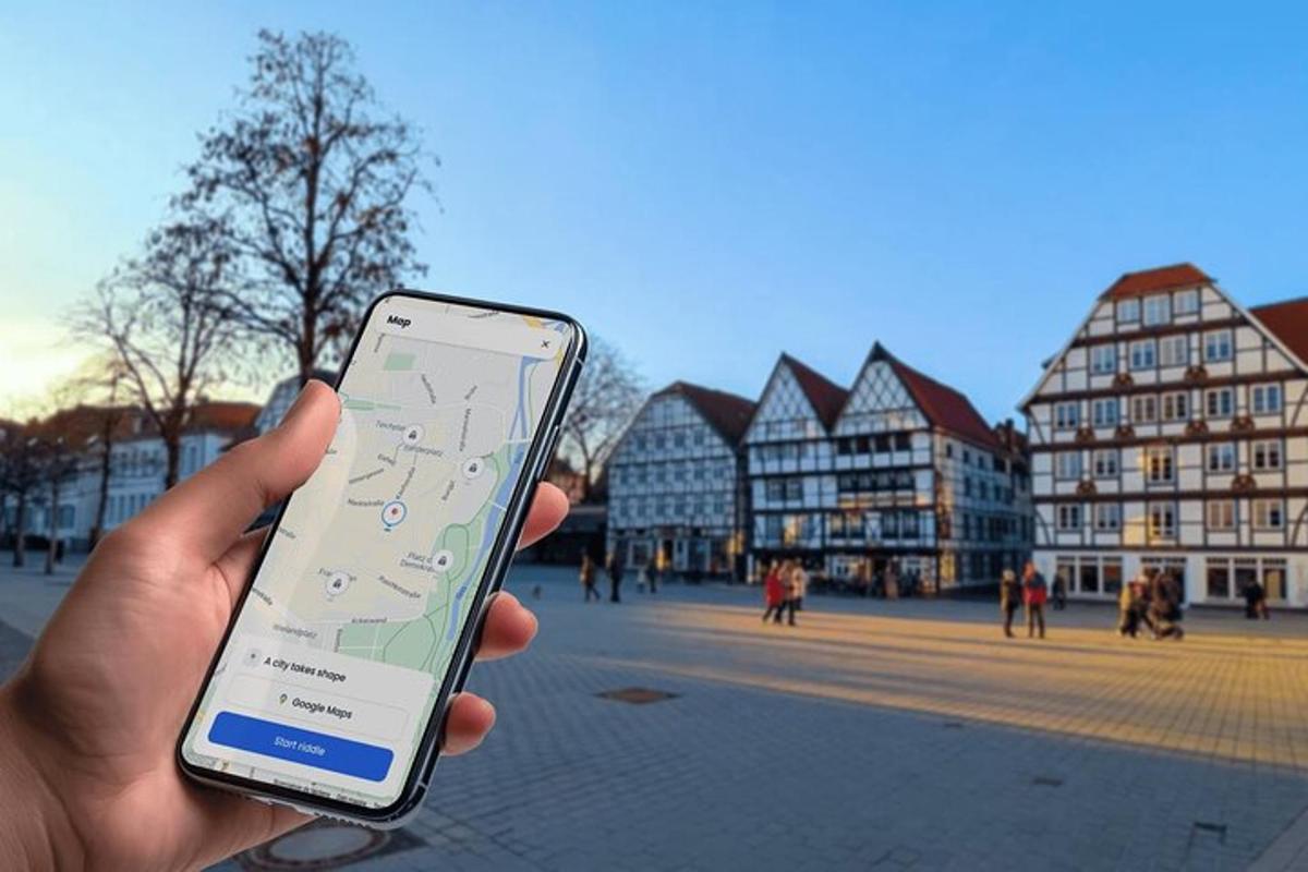 a person holding a cell phone in a city