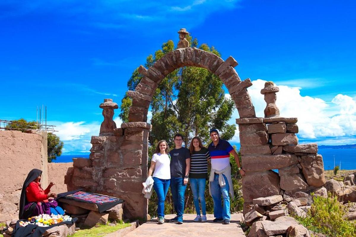 a group of people standing in front of a stone arch