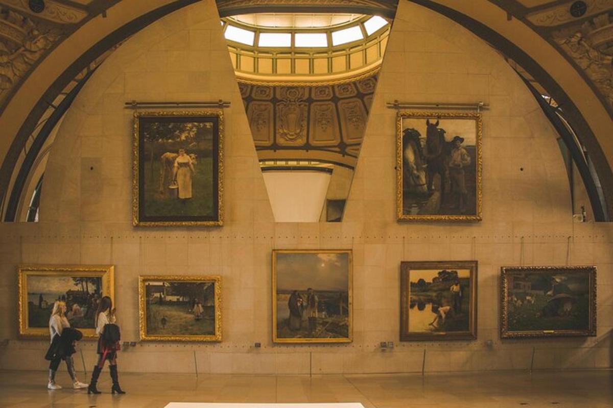 people walking in an art gallery with paintings on the wall