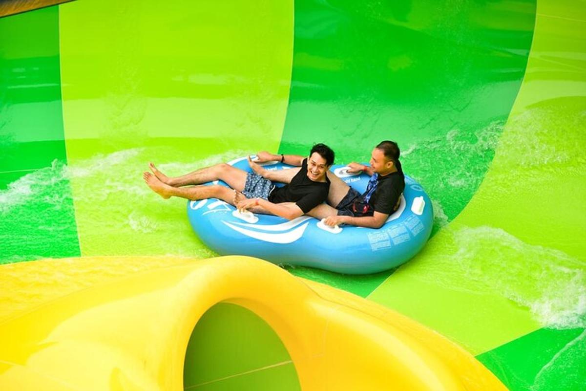 two people riding on a raft in the water