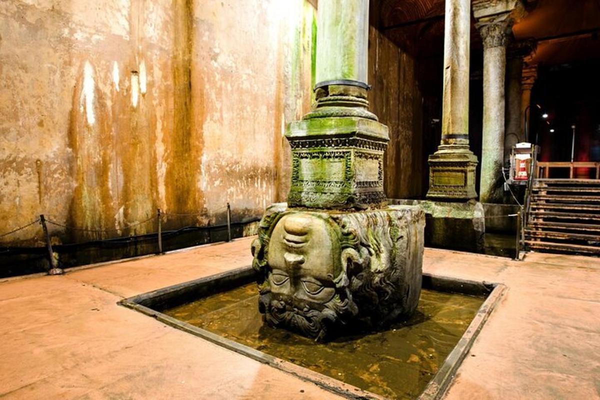 a fountain with a statue in a building