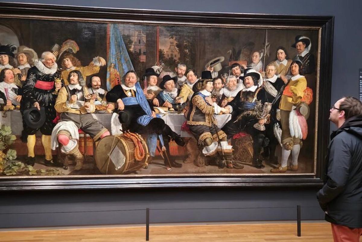 a painting of a group of people in a museum