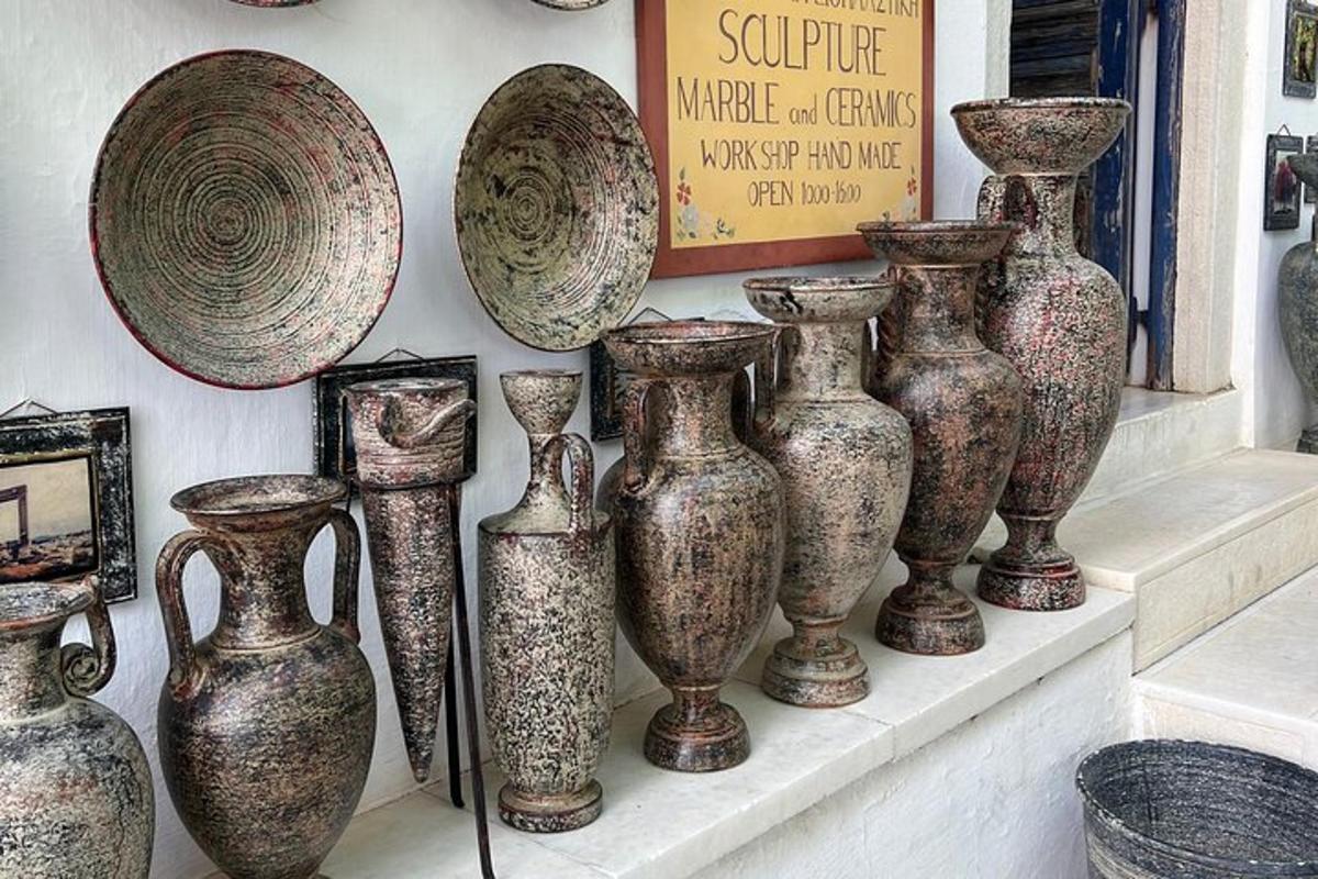 a group of vases on a shelf in a store