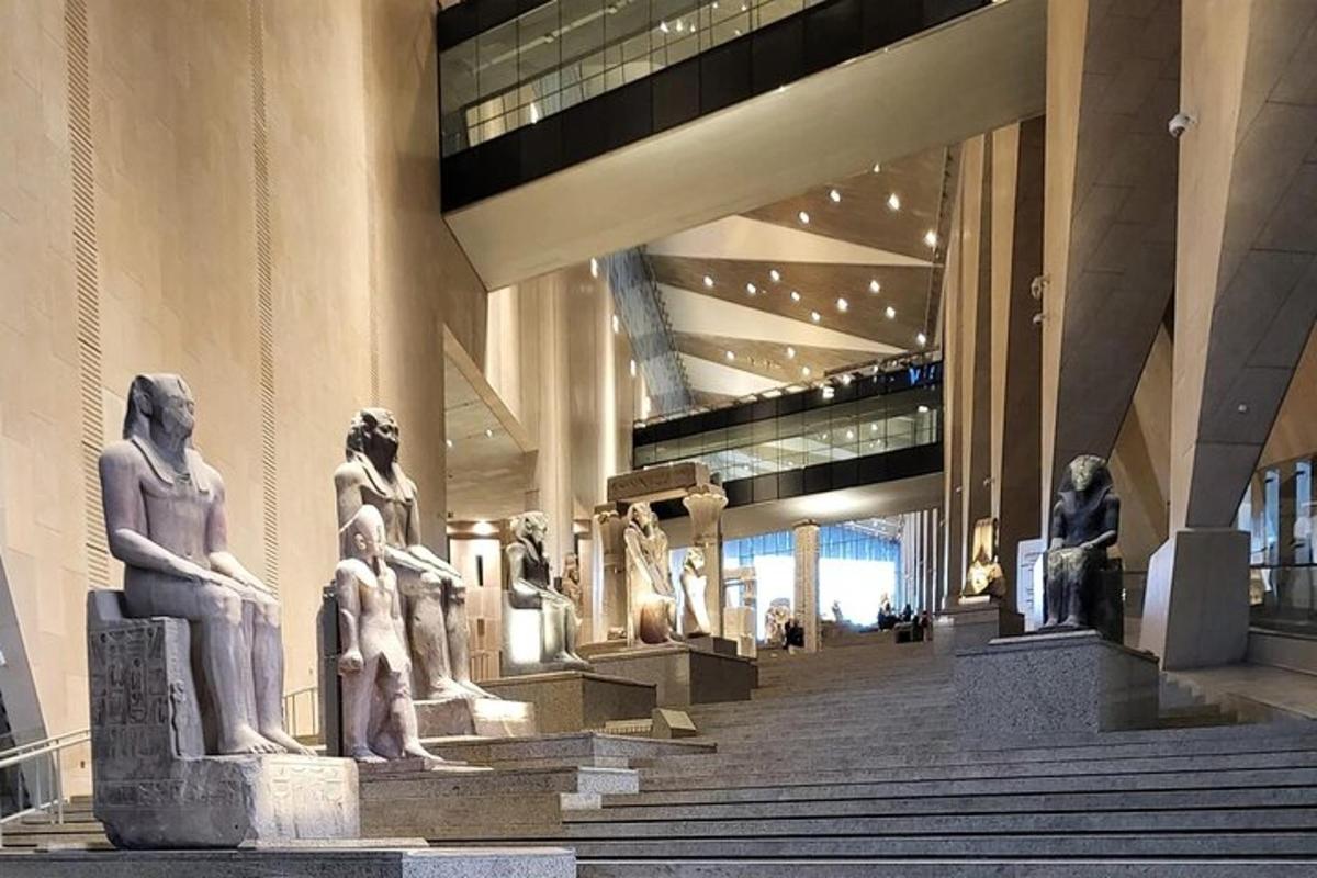 a museum with statues on display in a building