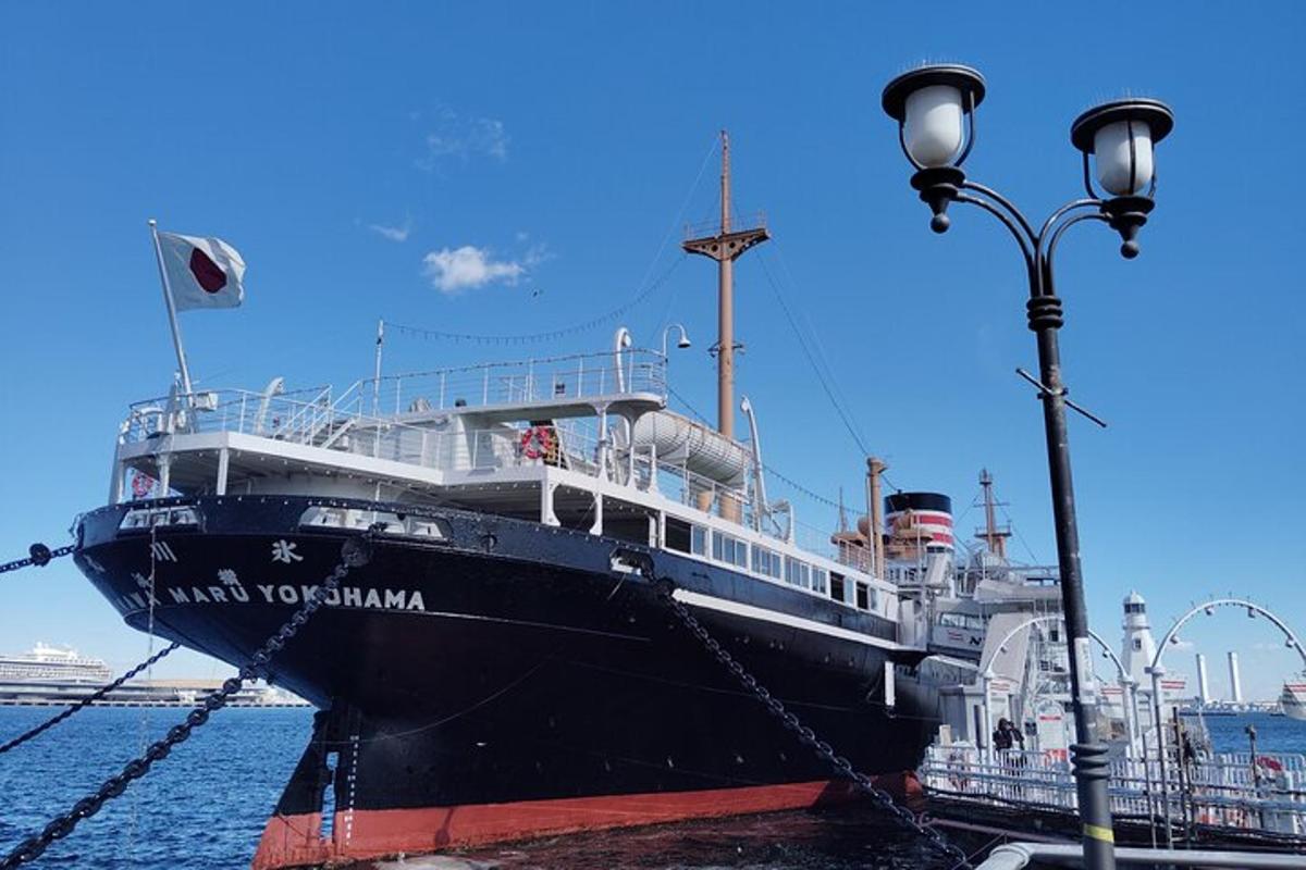 a cruise ship docked at a dock with a street light