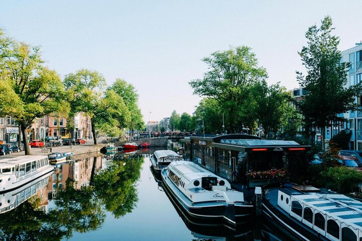 a group of boats are docked in a canal