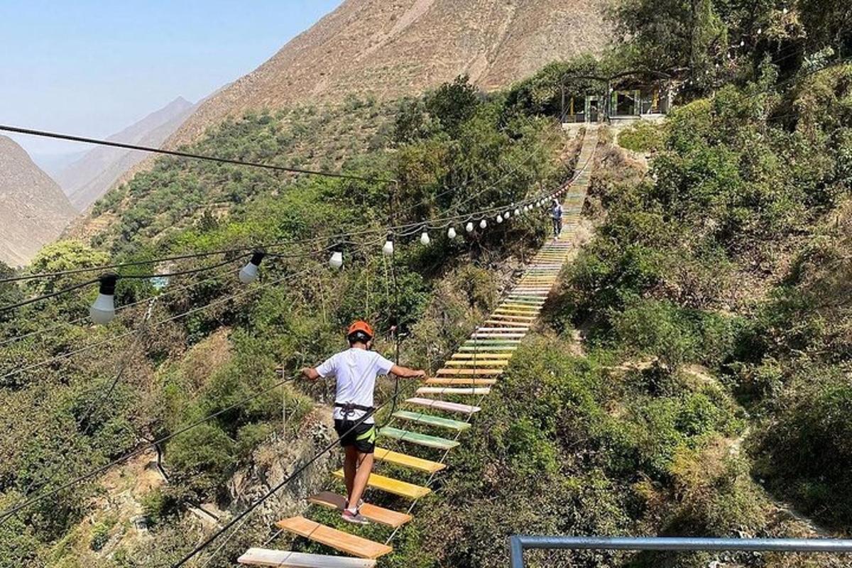 a man walking up a set of stairs on a mountain