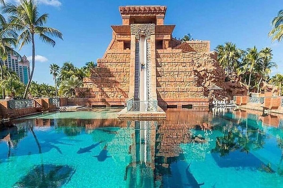 a large pool of water in front of a monument