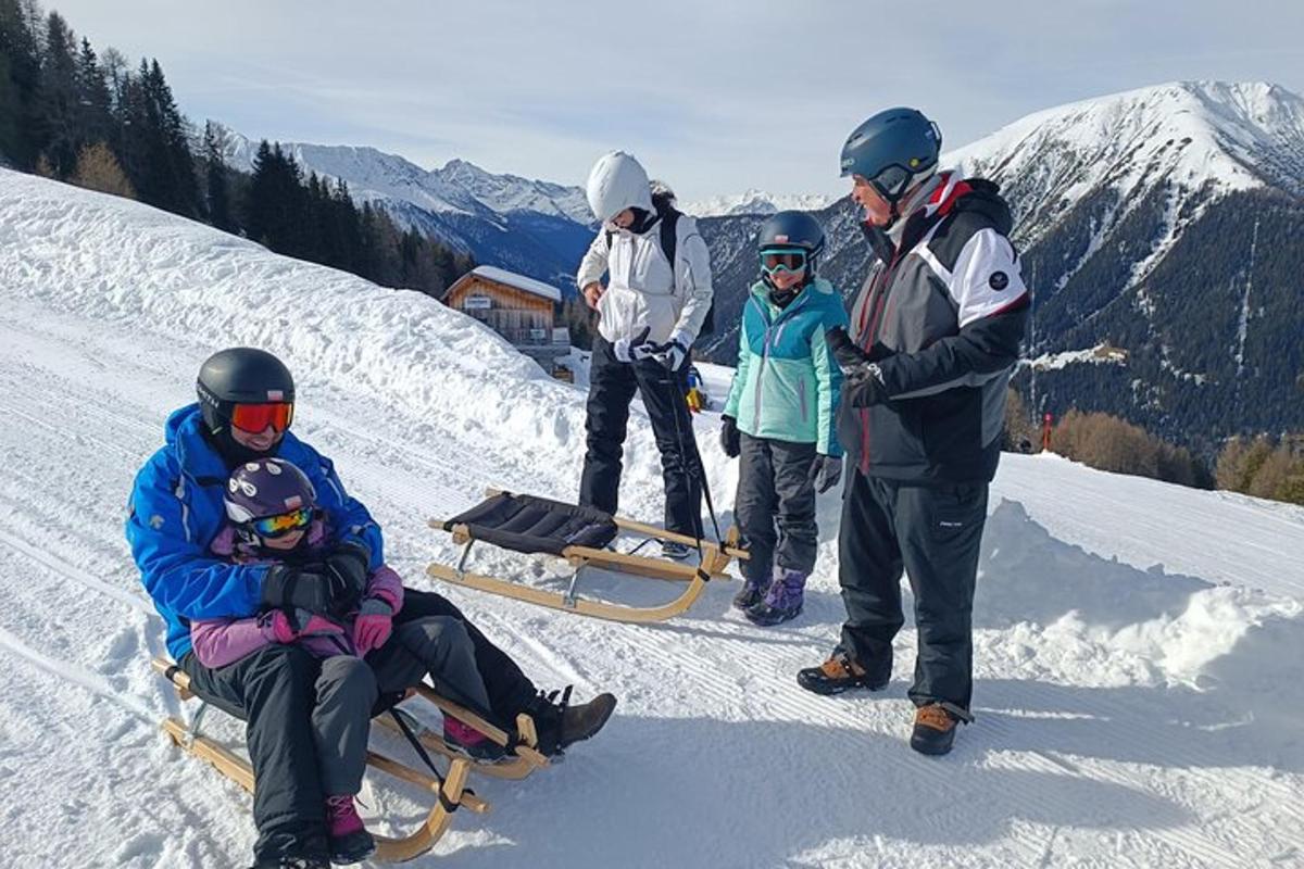 a group of people standing on top of a snow covered mountain