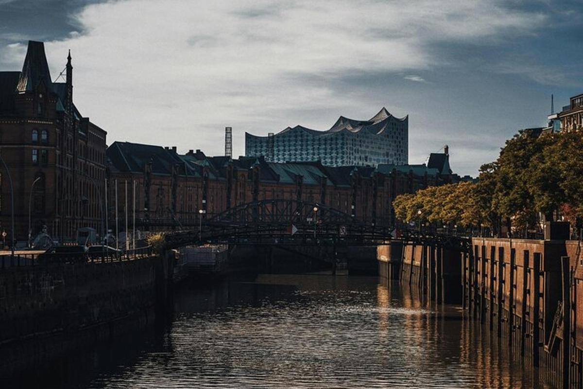 a river in a city with buildings and a bridge