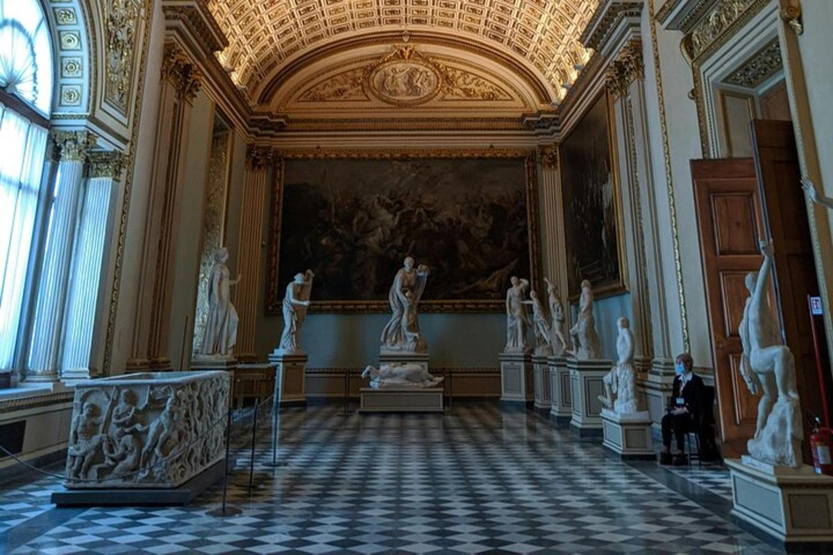 a room with statues on display in a building