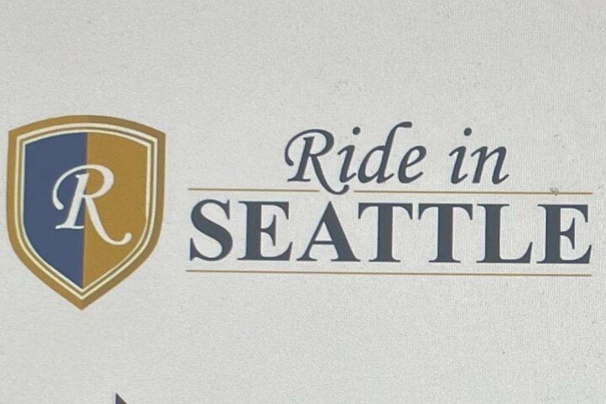 isang tanda para sa isang papel sa seattle na may isang kalasag