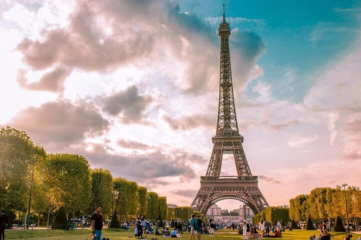 a view of the eiffel tower under a cloudy sky