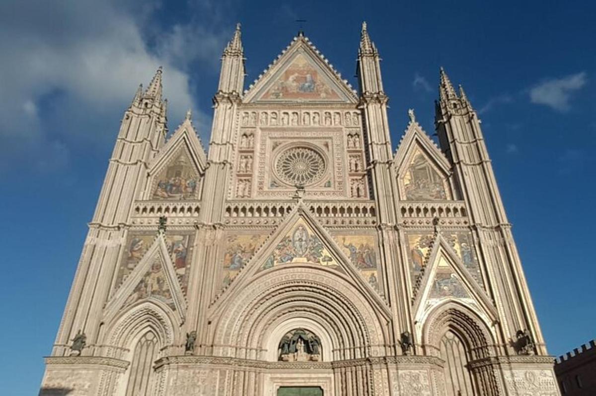 a large cathedral with a blue sky in the background