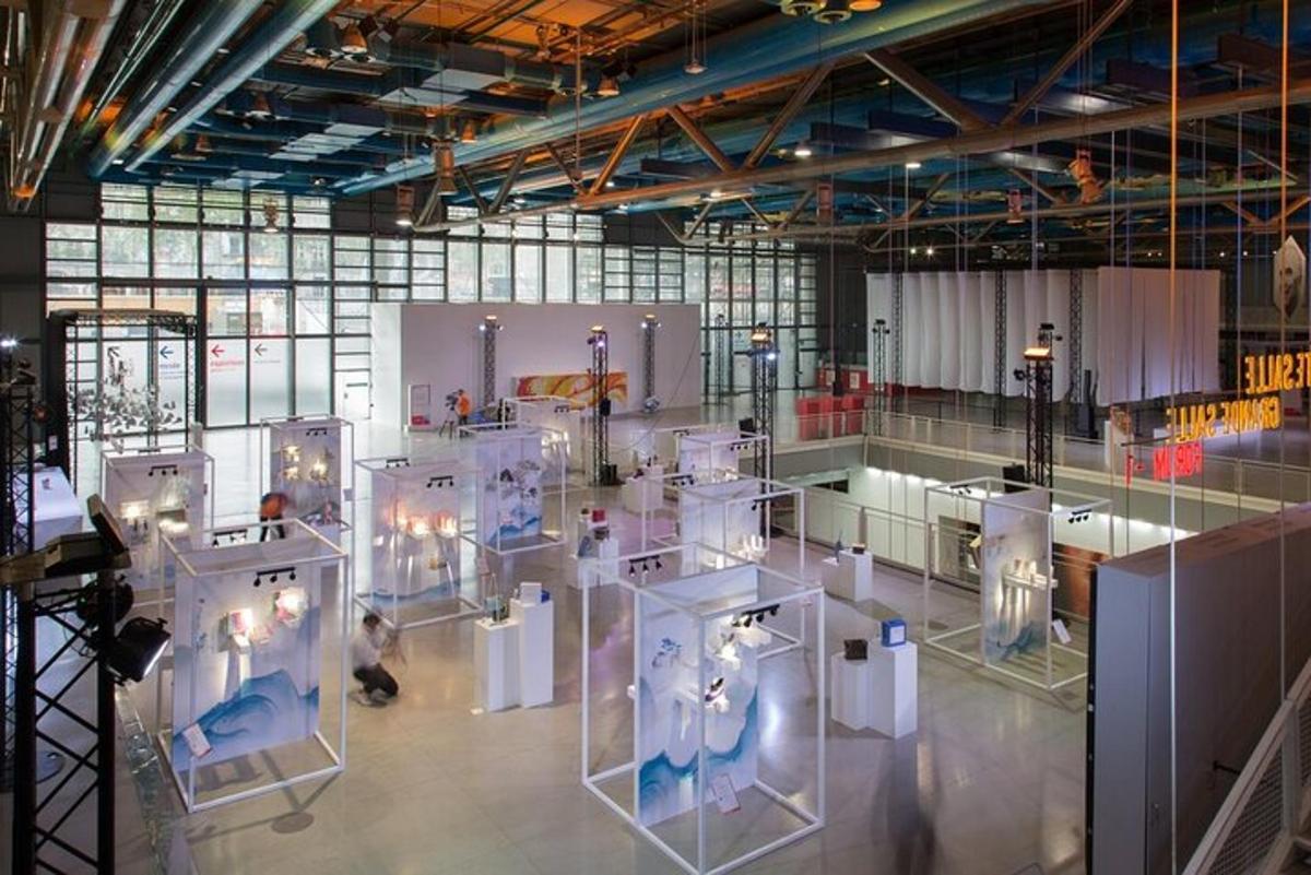 a large room with white exhibits in a building
