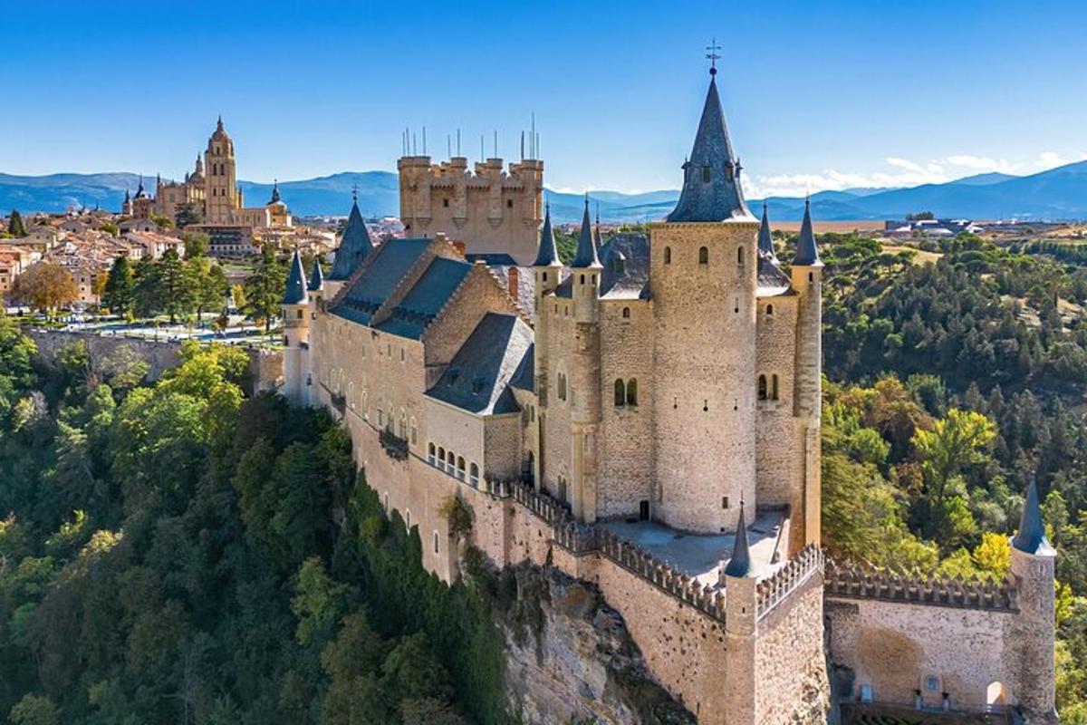 an aerial view of a castle on a hill