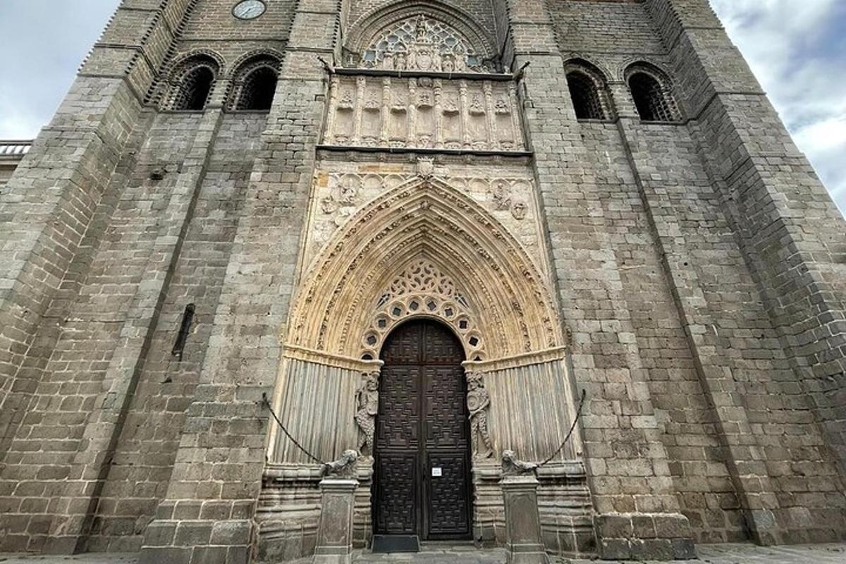 a church with a large tower with a black door