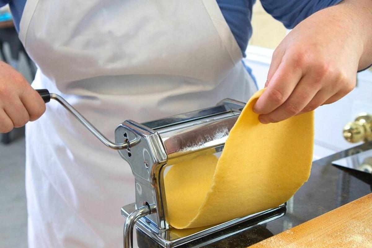 a person in a kitchen preparing food in a toaster