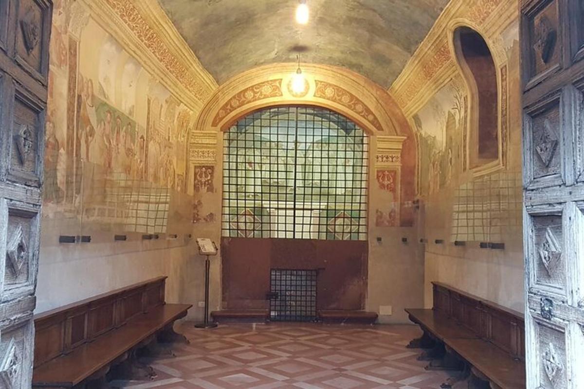 a large room with benches and a large window