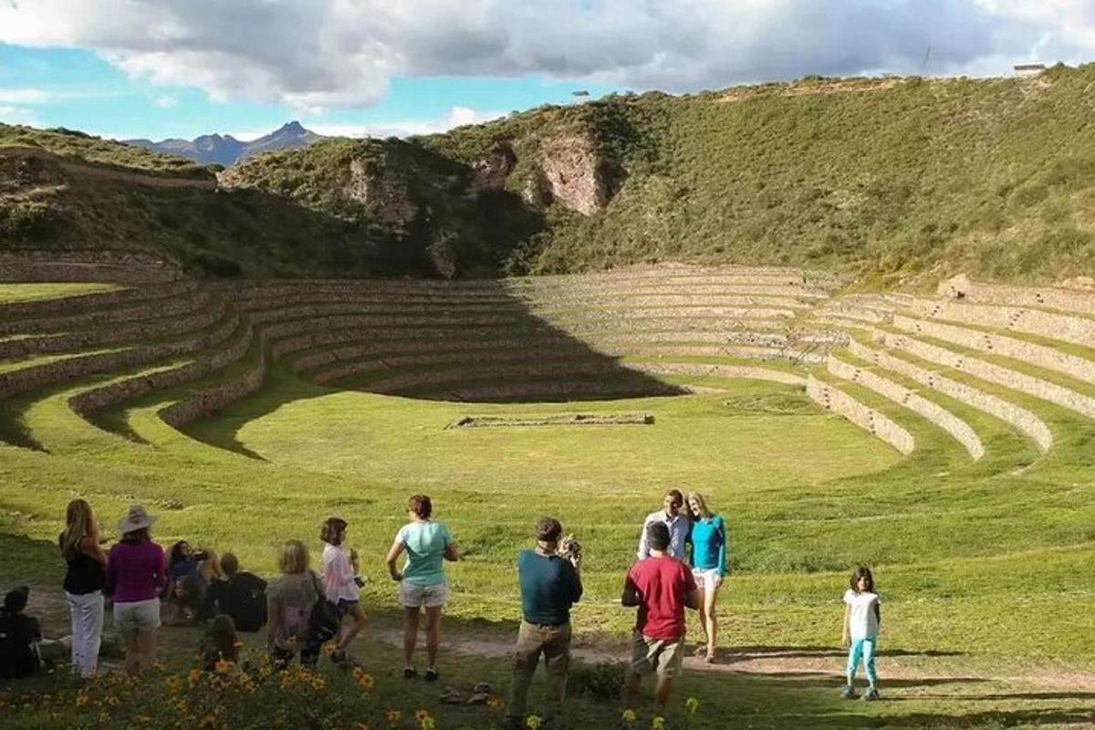 a group of people standing in front of an amphitheater