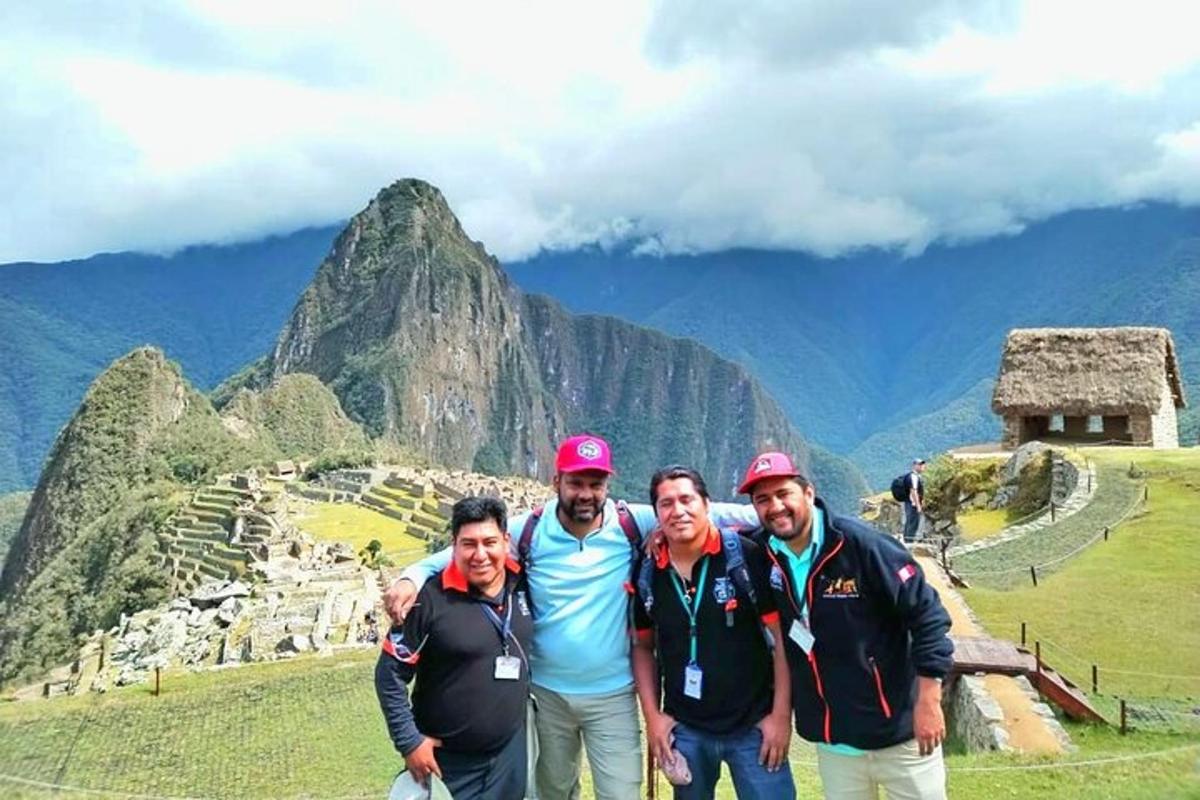 a group of people standing on top of a mountain