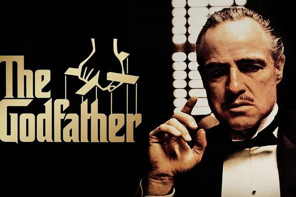 a poster of a man in a suit smoking a cigarette