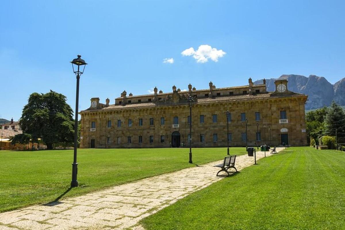 a large building with people sitting on top of it
