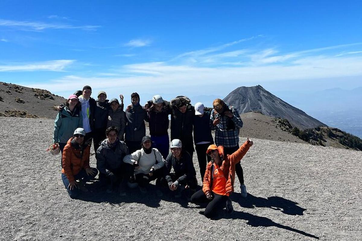 a group of people standing on top of a mountain