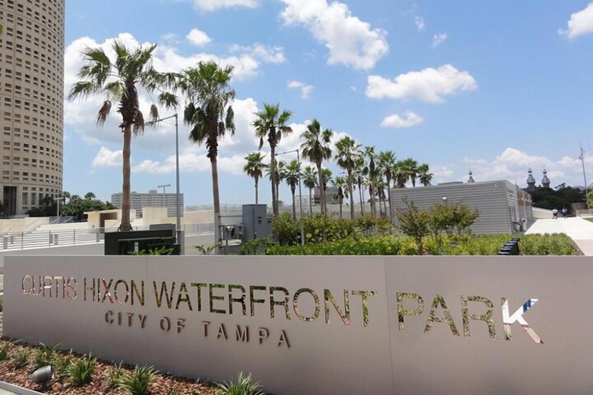 a sign for the city of tampa with palm trees